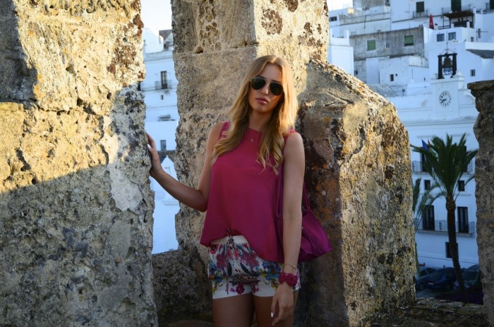 Pink top combined with floral patterned shorts