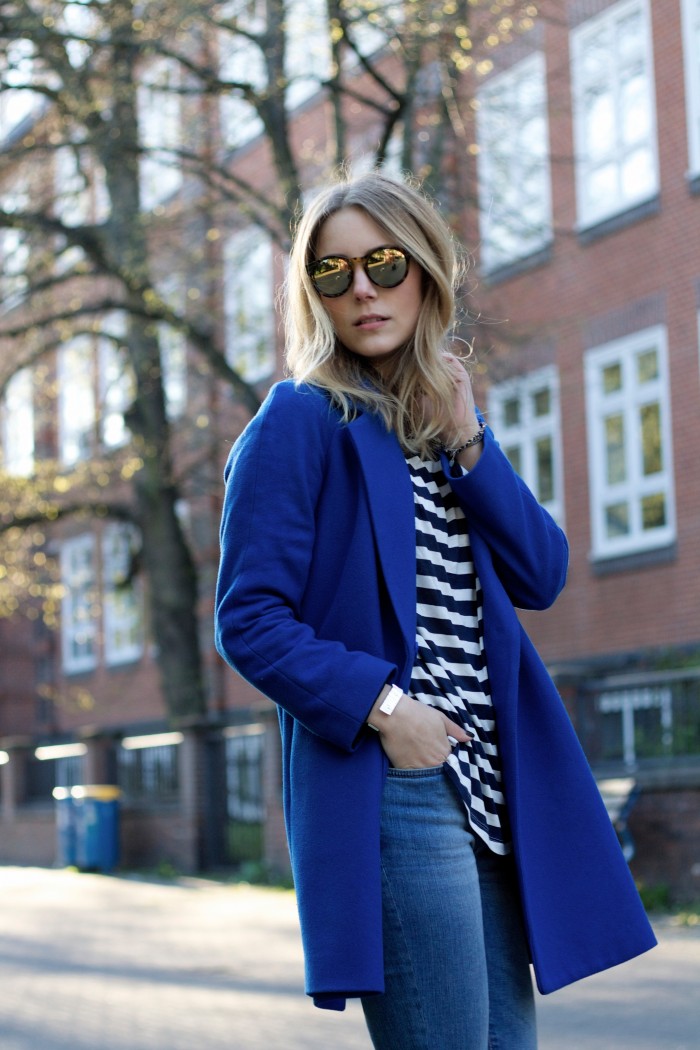 Blond Girl with a royal blue coat